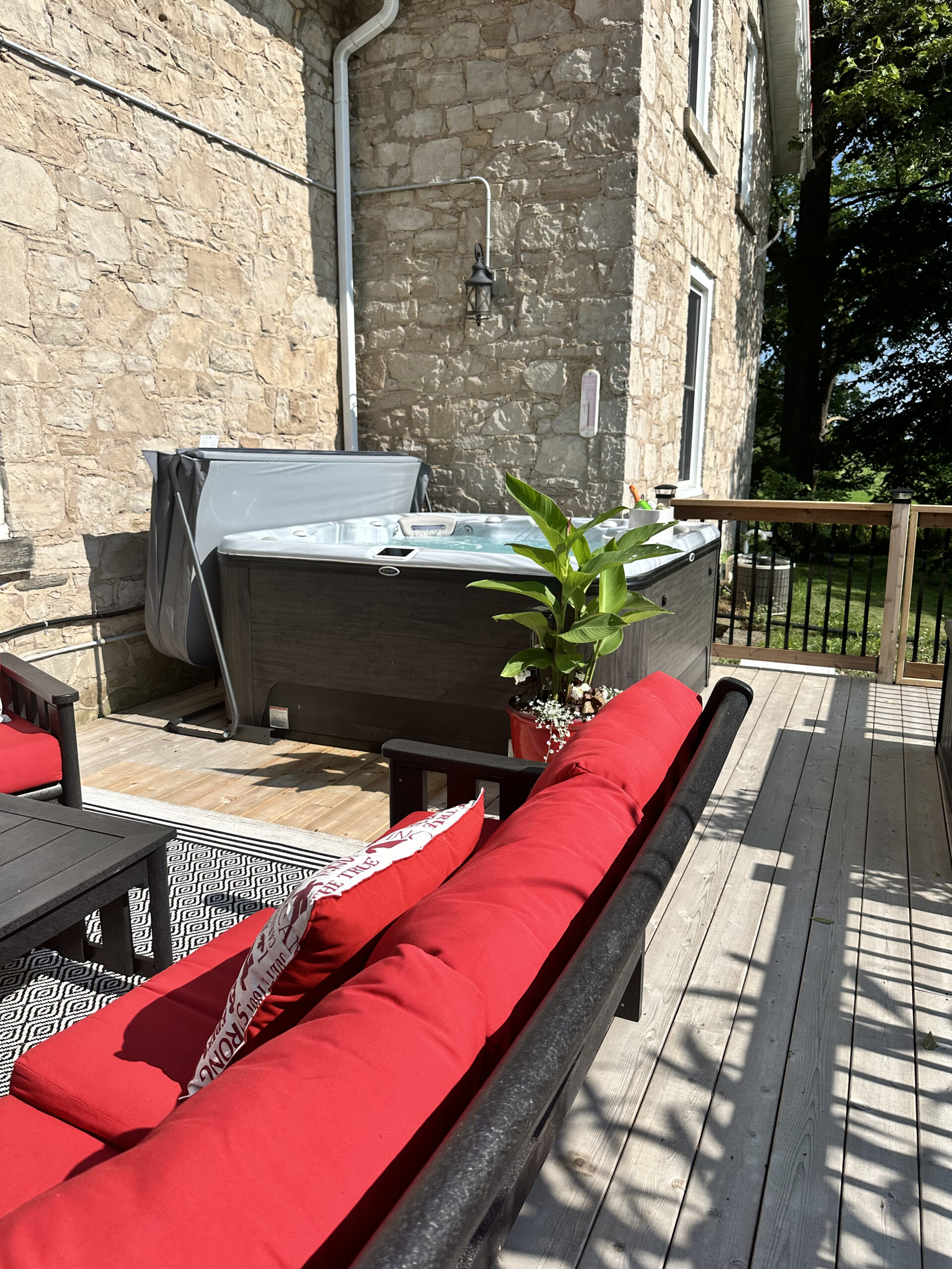 A patio with a hot tub.